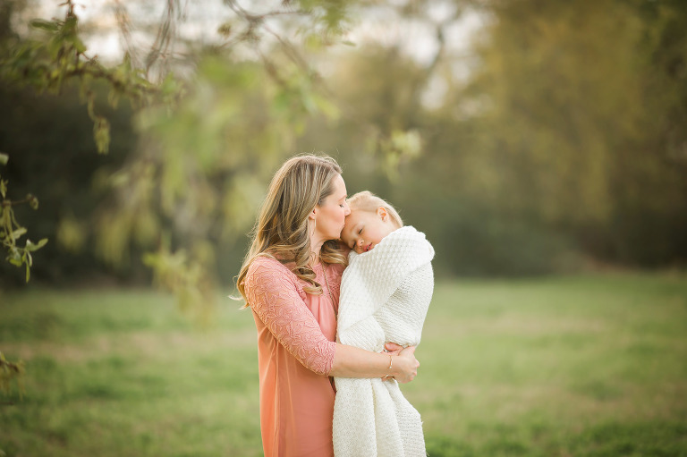 Mother snuggling her daughter in Houston session.